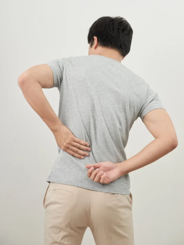 man-with-back-pain-isolated-white-background